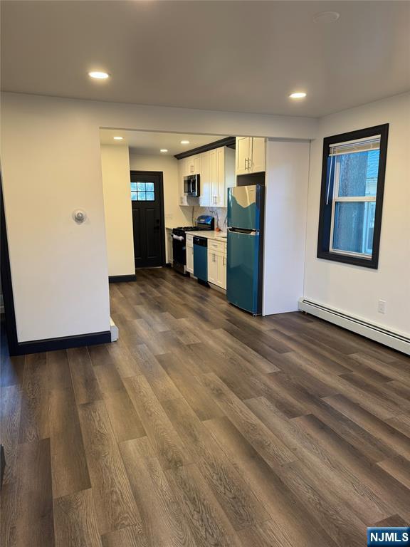 27 Emerald Street Hackensack, NJ 07601 - Photo 5 of 42 a view of a kitchen with refrigerator and wooden floor