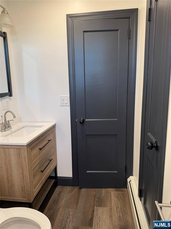 27 Emerald Street Hackensack, NJ 07601 - Photo 10 of 42 a bathroom with a sink a toilet a mirror and shower