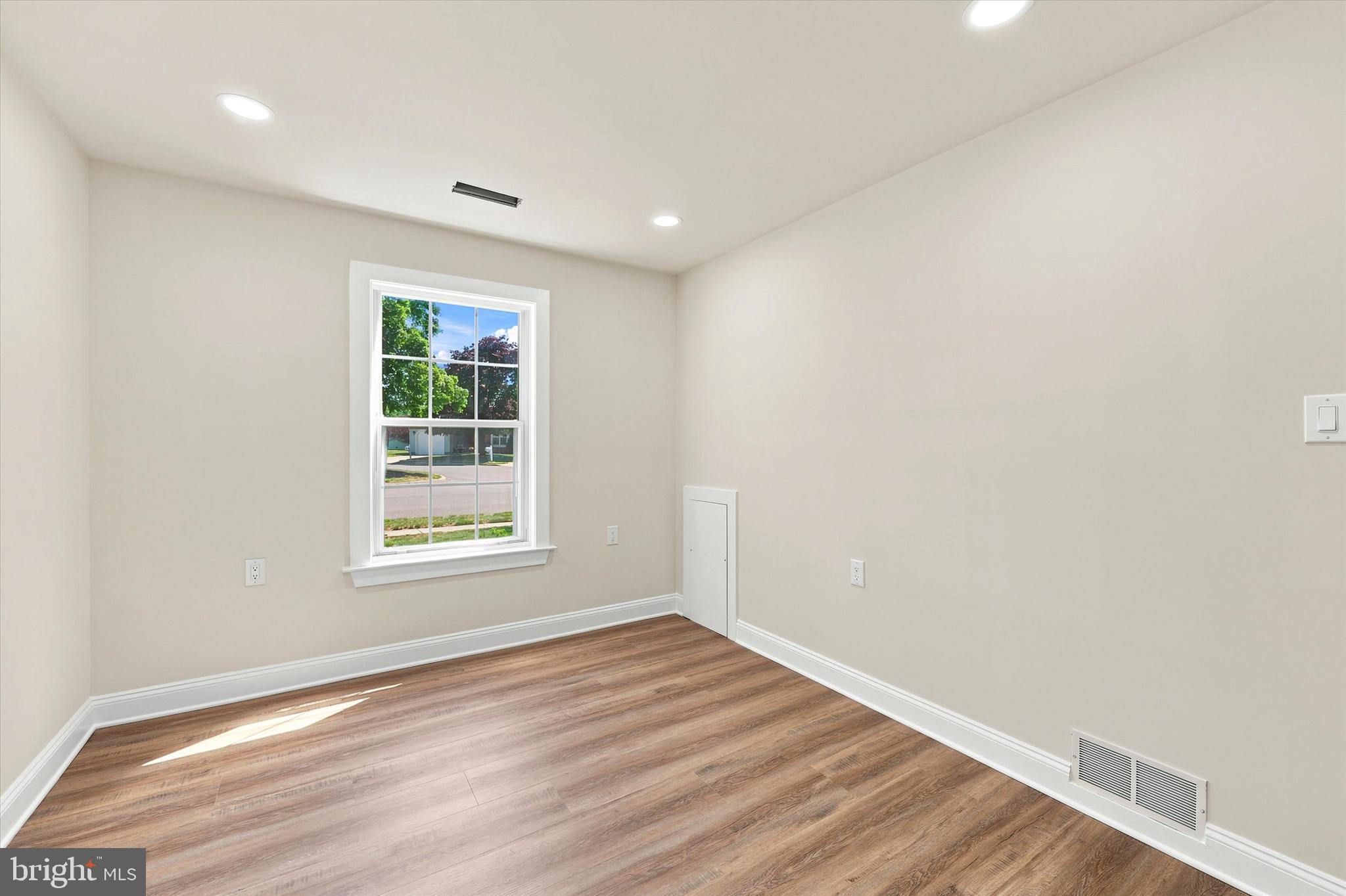 2 Emory Lane Mount Laurel, NJ 08054 - Photo 10 of 25 an empty room with wooden floor and windows