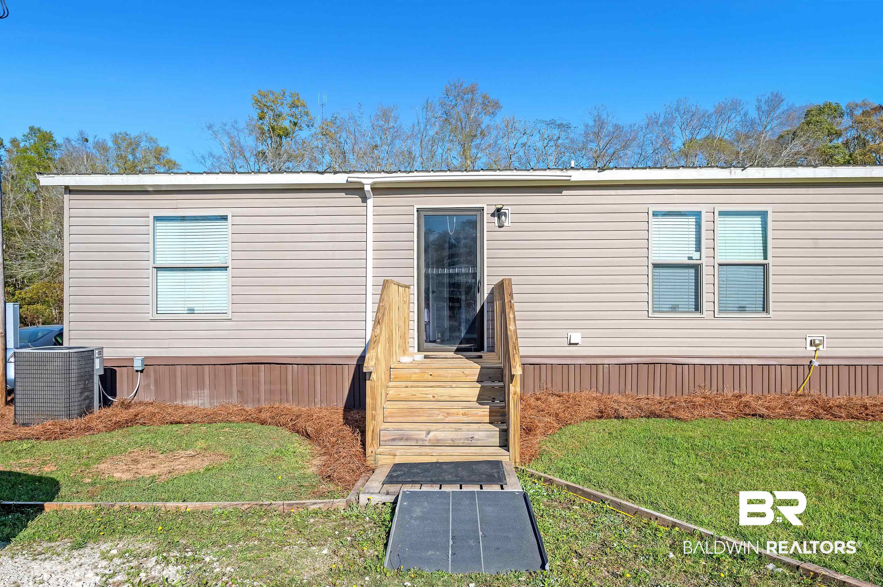 23233 Forland Road Silverhill, AL 36576 - Photo 6 of 33 Rear view of property featuring cooling unit and a yard