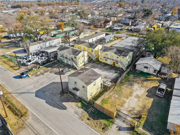 an aerial view of a residential houses with outdoor space