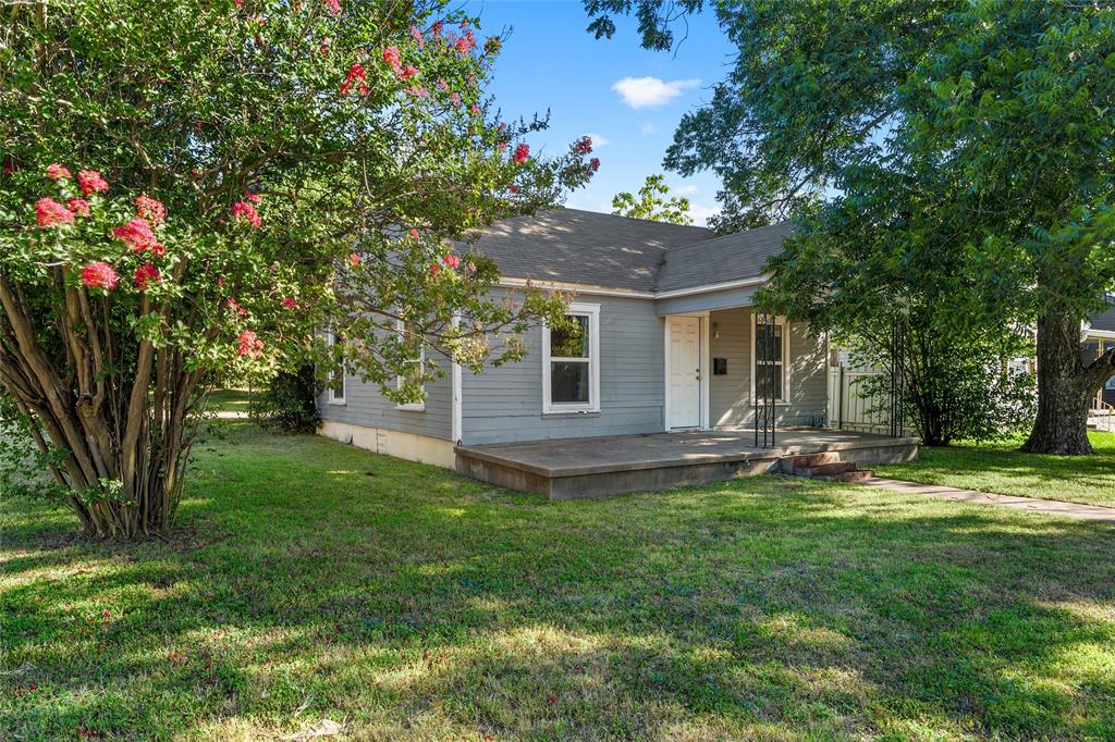 2225 Mitchell Avenue Waco, TX 76708 - Photo 3 of 16 Single-story residence featuring a gray exterior siding and a covered front porch