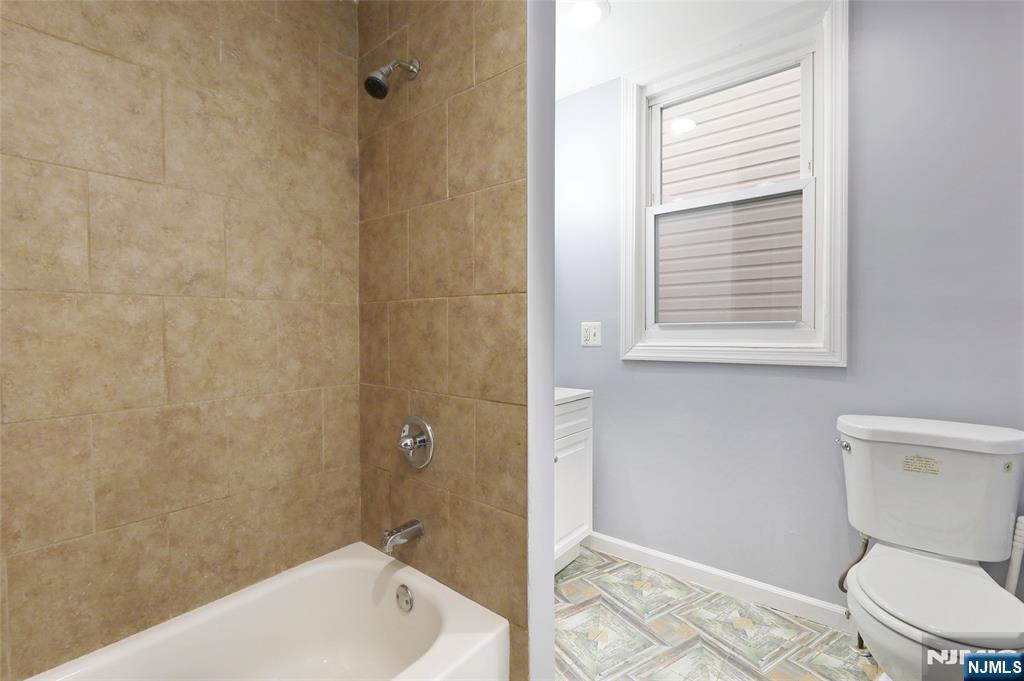 119 Ridgewood Avenue Newark, NJ 07108 - Photo 16 of 38 a bathroom with a toilet a sink and bathtub