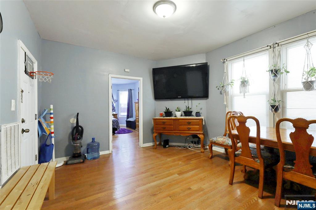 119 Ridgewood Avenue Newark, NJ 07108 - Photo 29 of 38 a view of a livingroom with furniture and a flat screen tv
