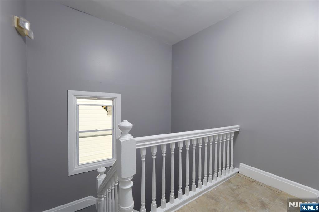 119 Ridgewood Avenue Newark, NJ 07108 - Photo 5 of 38 a view of a room that has a window