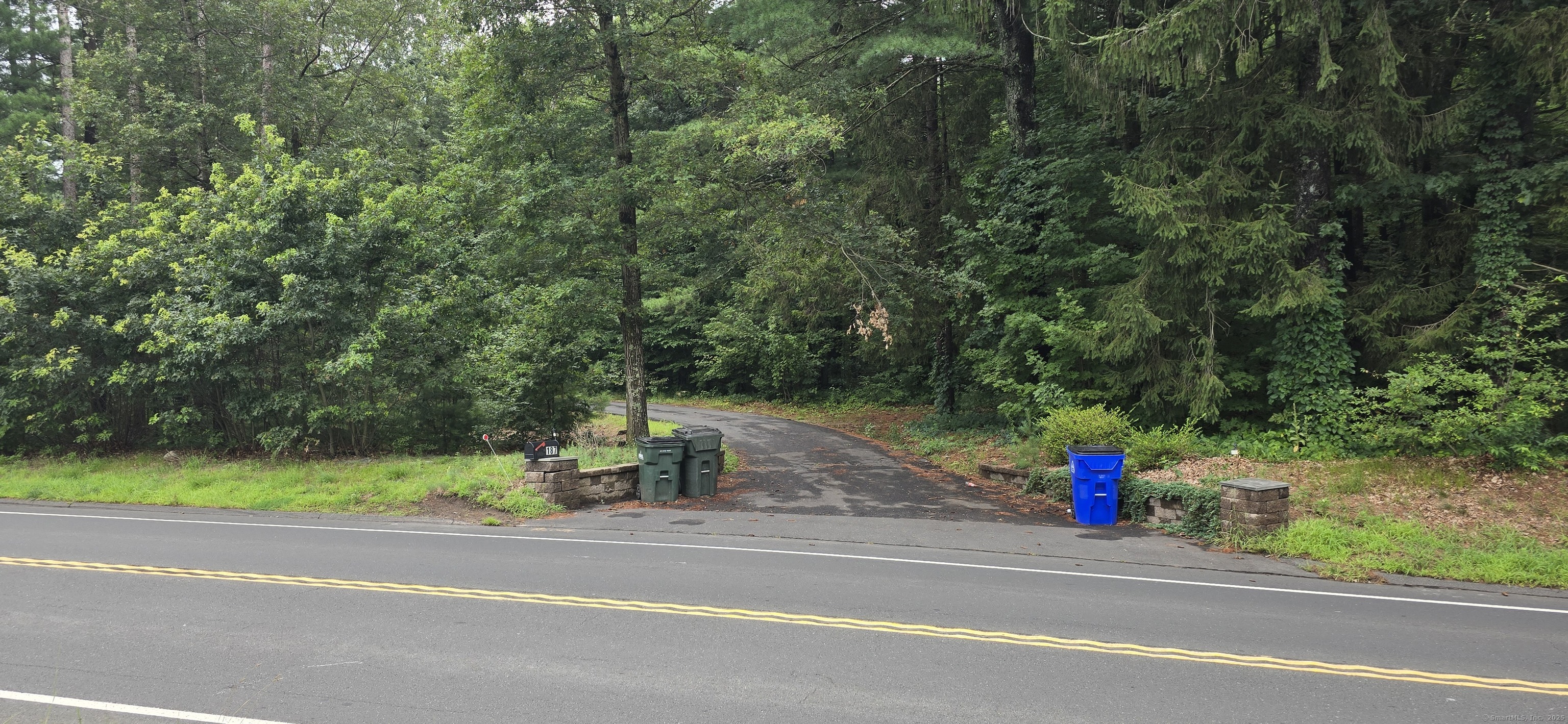 189 West Avon Road Avon, CT 06001 - Photo 2 of 12 a view of a entertaining space and a car parked on the road