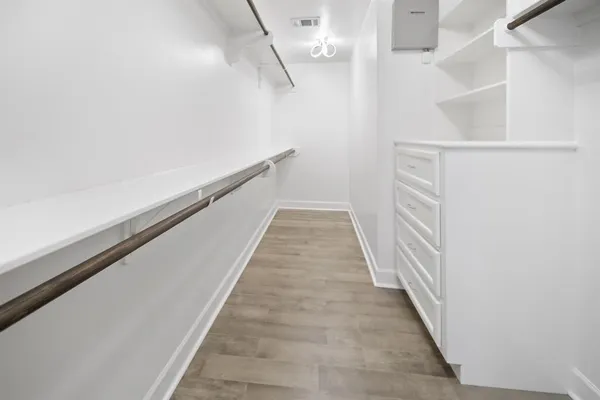 a view of a hallway with stairs
