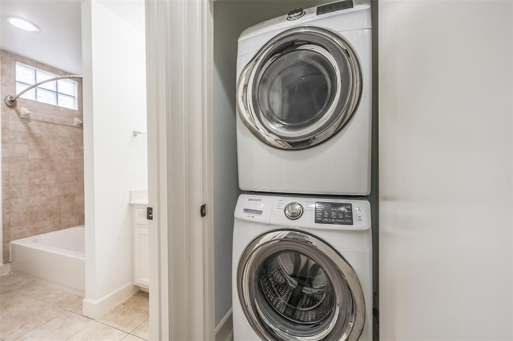7650 Springhill Street, Unit 403 Houston, TX 77021 - Photo 26 of 30 a view of a hallway with washer and dryer