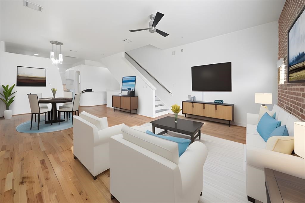 7650 Springhill Street, Unit 403 Houston, TX 77021 - Photo 5 of 30 a living room with furniture and a flat screen tv