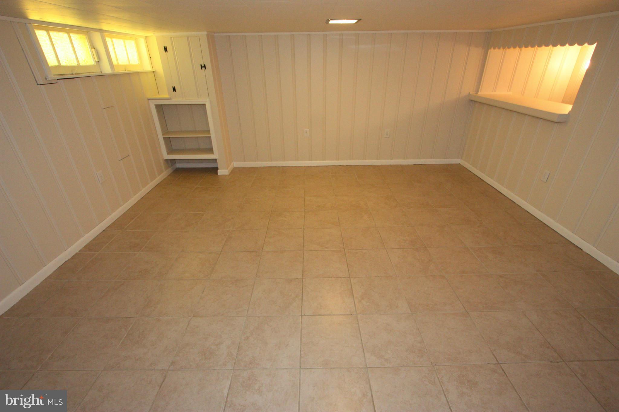 1842 Glen Ridge Road Baltimore, MD 21286 - Photo 20 of 30 BASEMENT FAMILY ROOM WITH NATURAL LIGHT