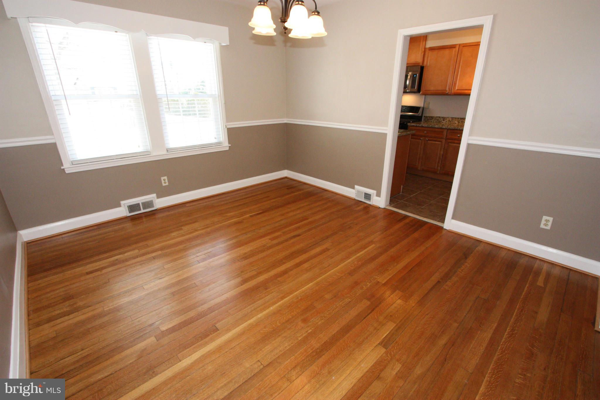 1842 Glen Ridge Road Baltimore, MD 21286 - Photo 8 of 30 DINING ROOM HAS TWO-TONE PAINT AND CHAIR RAIL