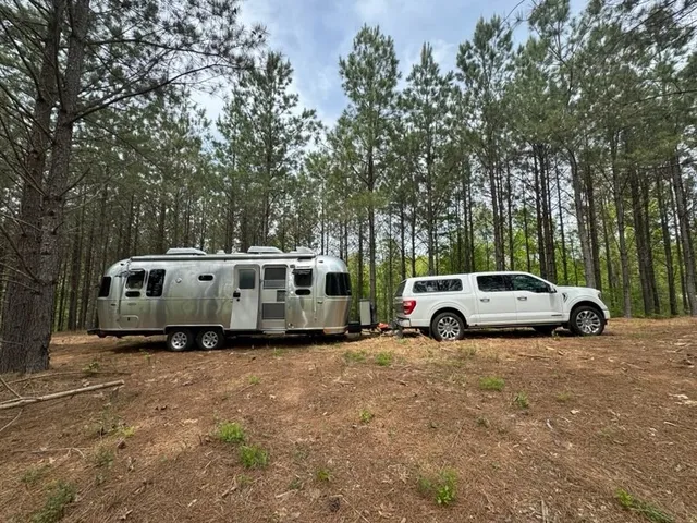 a view of a house with truck parked on the road
