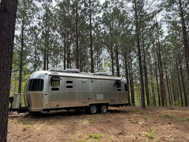 a view of a white house with a large window