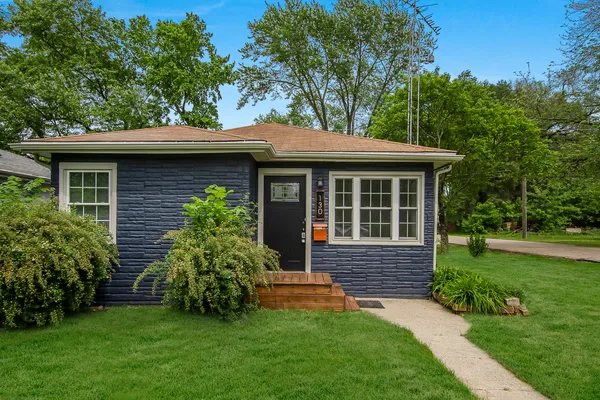 a view of a house with a garden