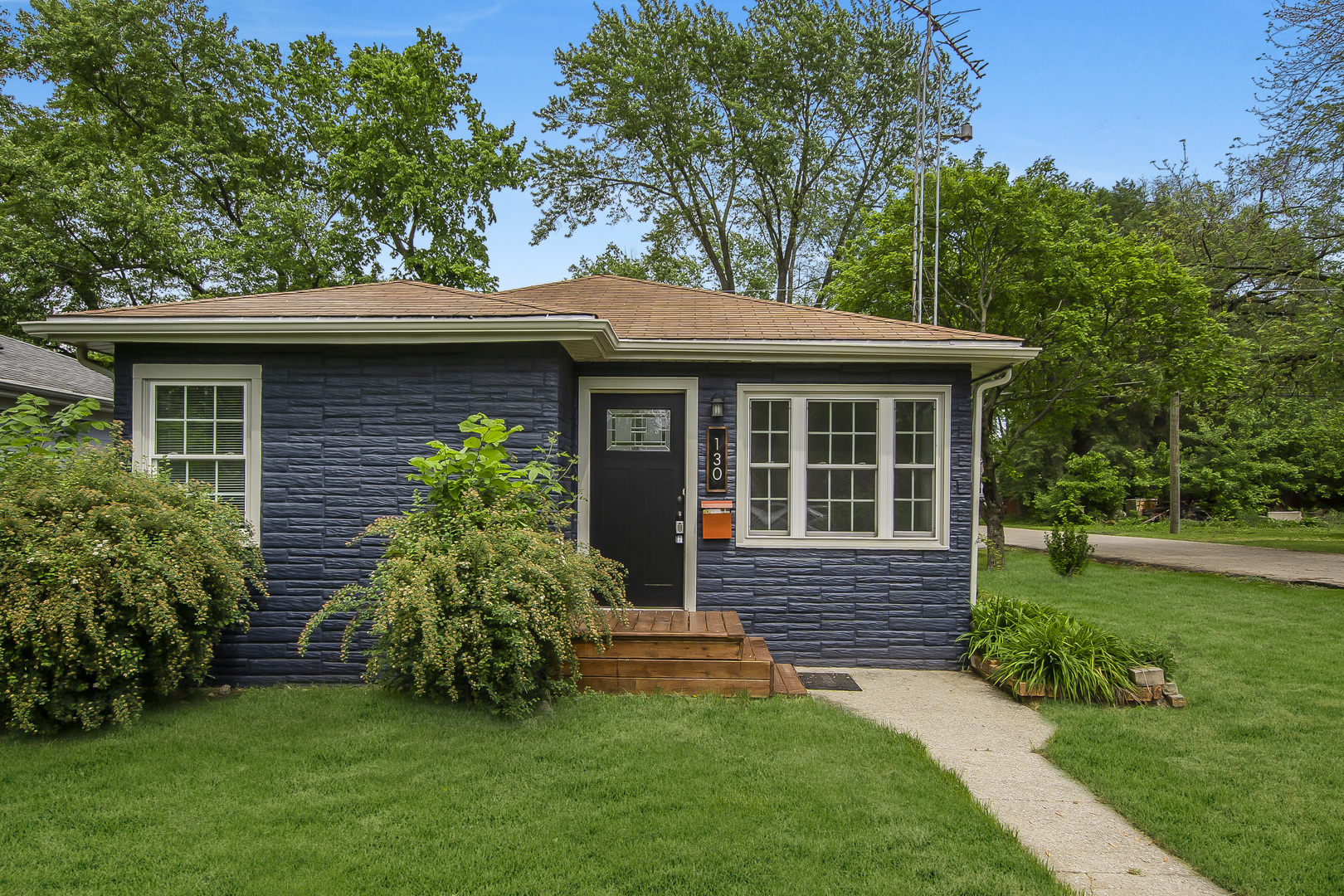 a view of a house with a garden