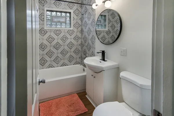 a bathroom with a toilet and a sink