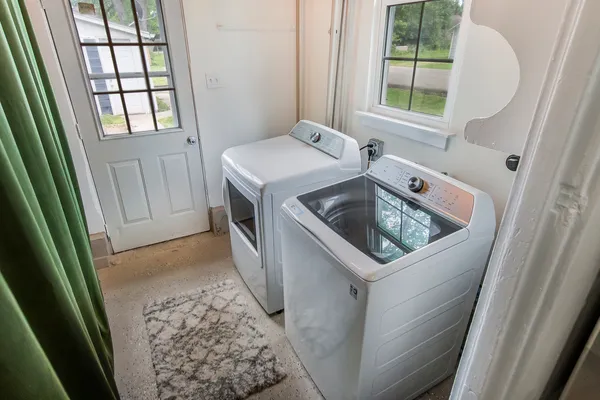 a utility room with a sink a washer and dryer