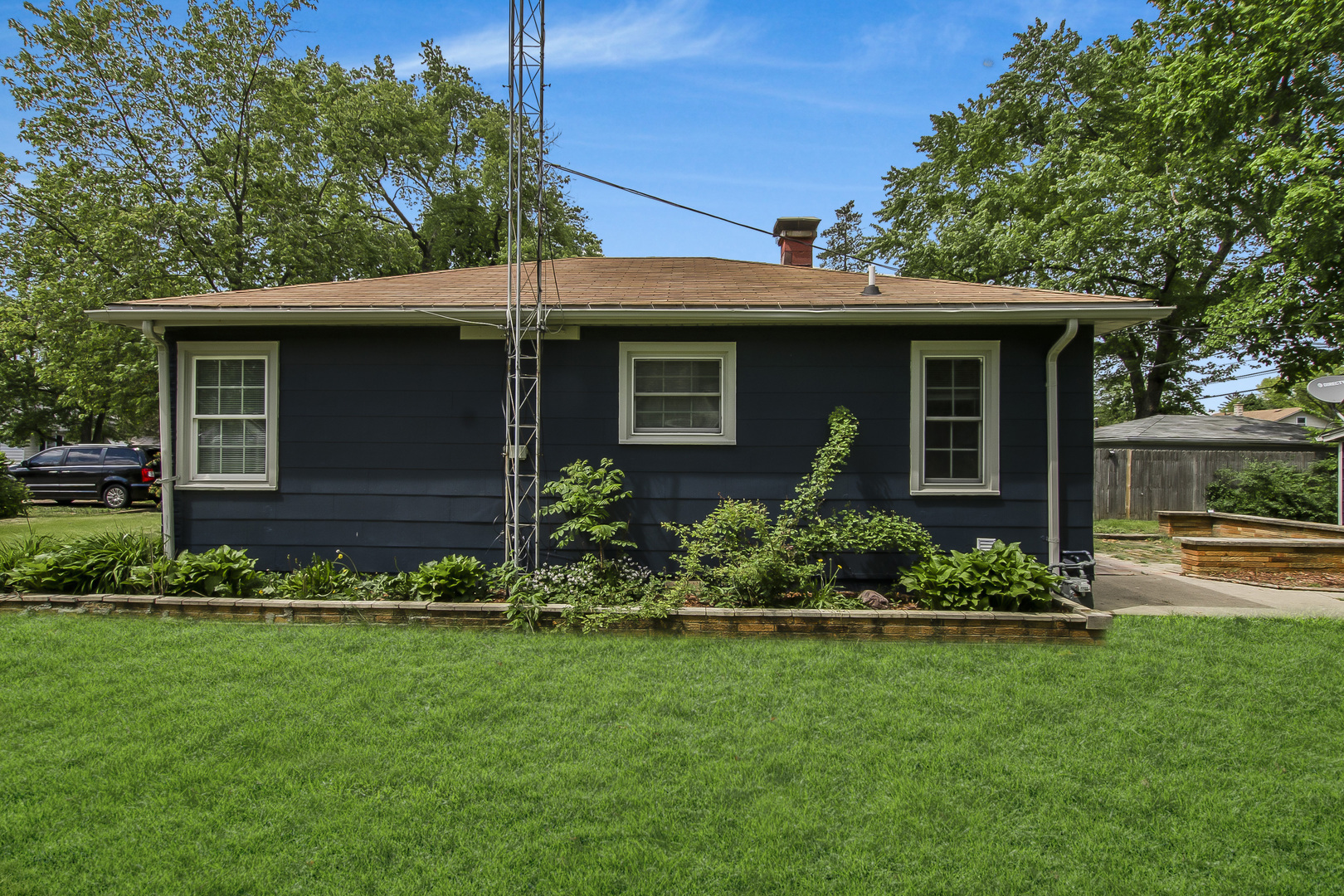 130 South Park Road Joliet, IL 60433 - Photo 3 of 22 a front view of a house with a garden