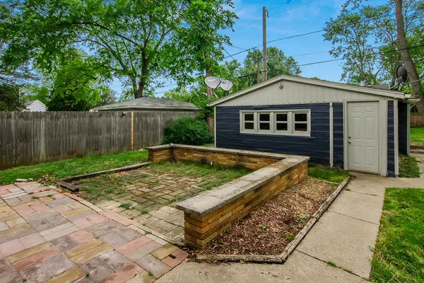a view of backyard with small pool