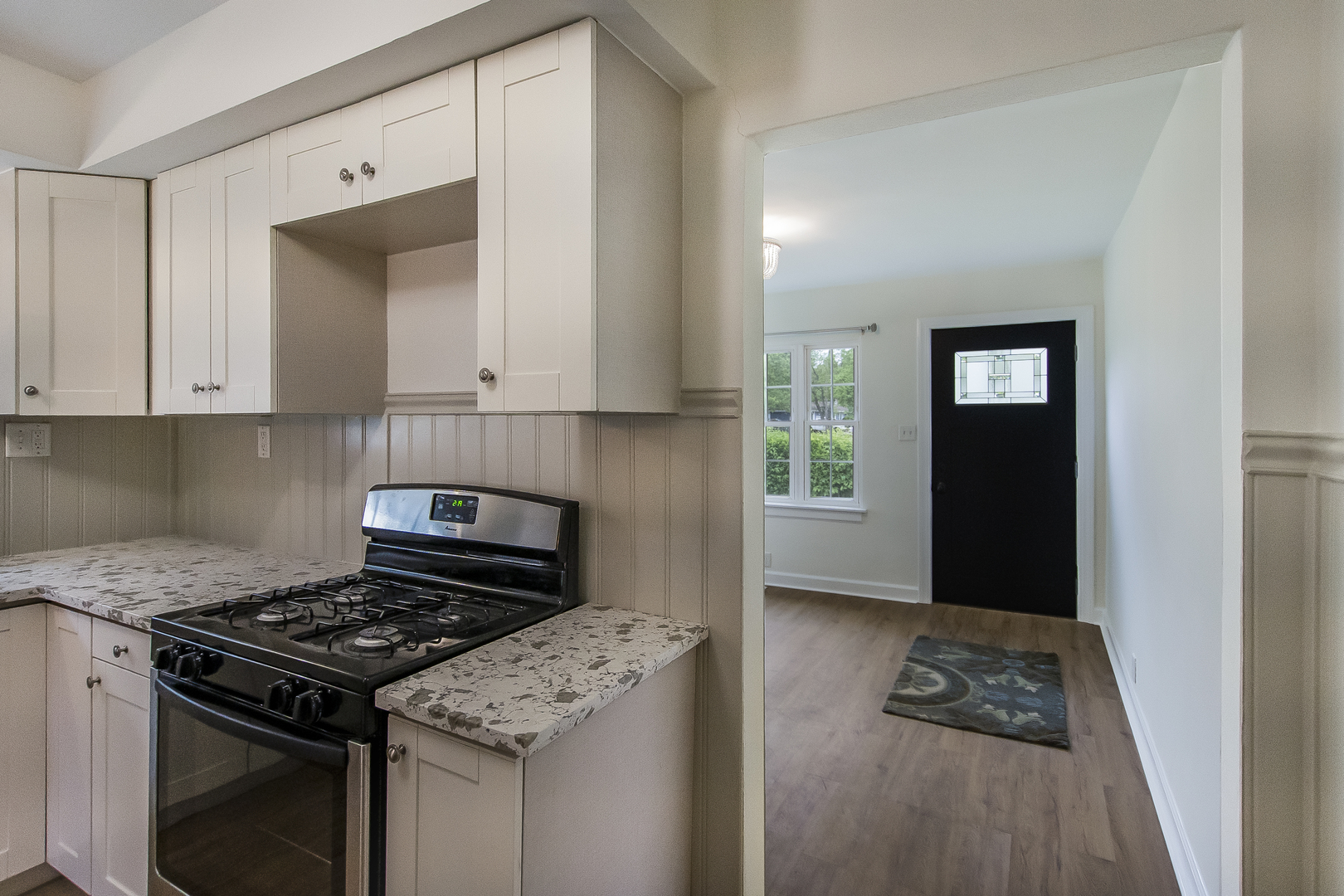 130 South Park Road Joliet, IL 60433 - Photo 10 of 22 a kitchen with granite countertop a stove and a refrigerator