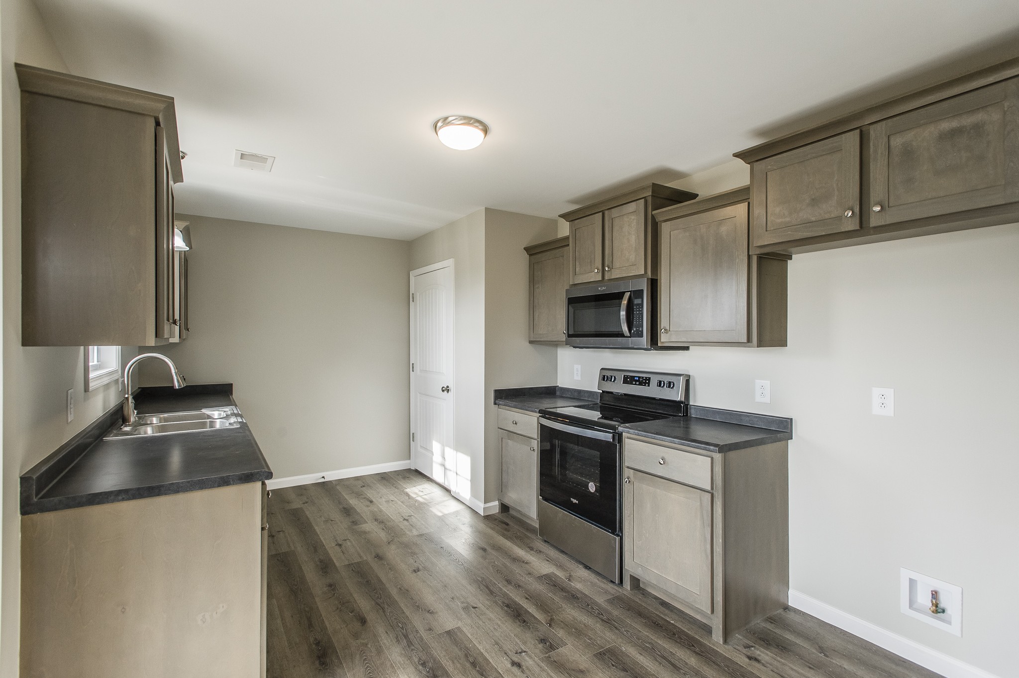 4641 Highway 161 Springfield, TN 37172 - Photo 7 of 25 a kitchen with granite countertop a sink and steel appliances