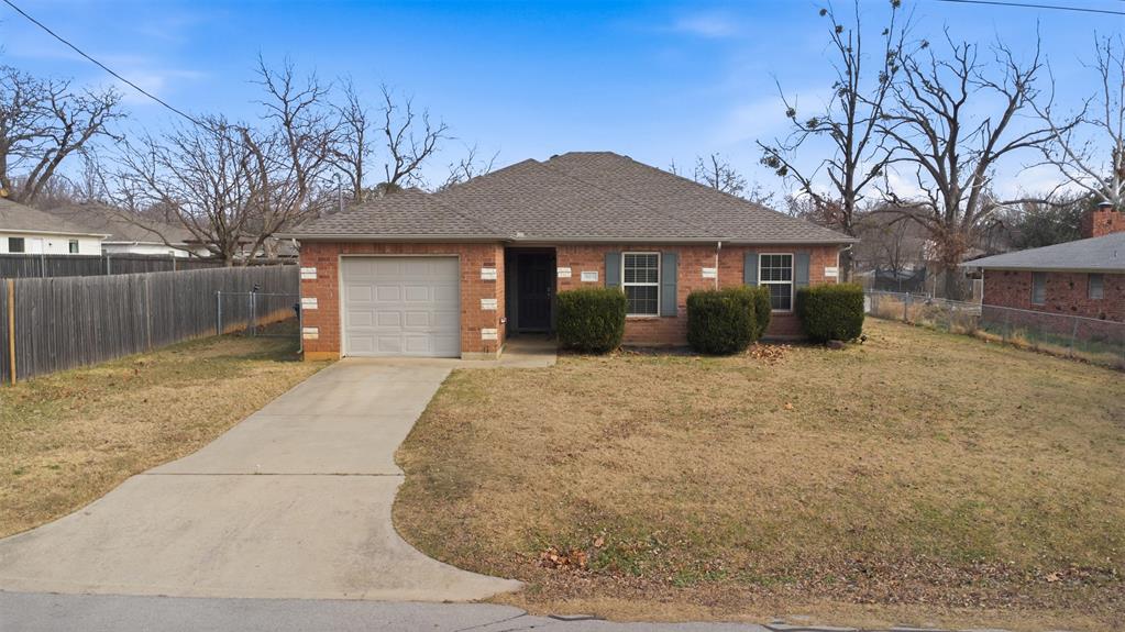 503 Caddell Street Aubrey, TX 76227 - Photo 1 of 39 a front view of a house with a yard and garage