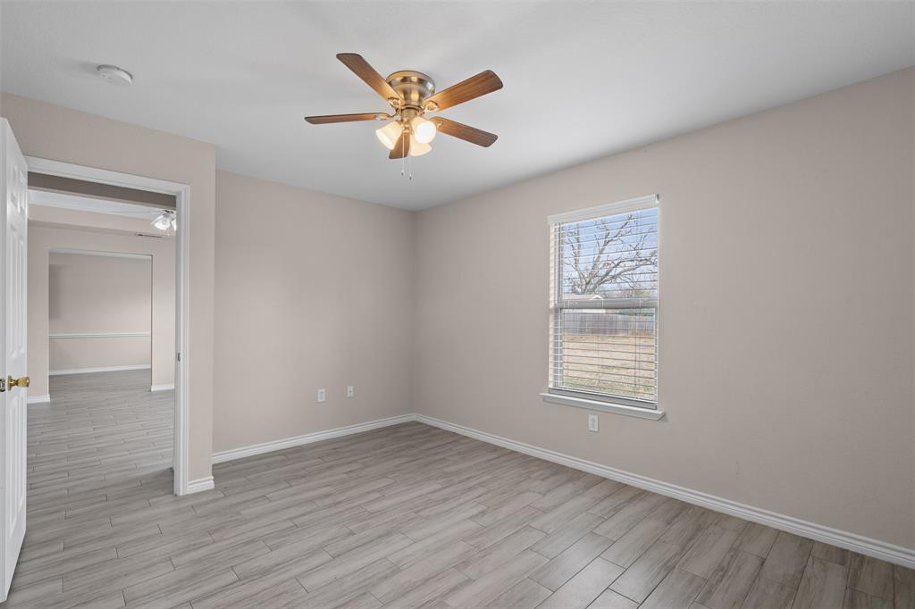 503 Caddell Street Aubrey, TX 76227 - Photo 25 of 39 wooden floor in an empty room with a window