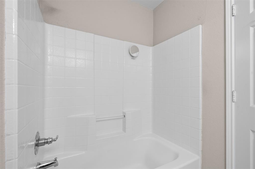 503 Caddell Street Aubrey, TX 76227 - Photo 27 of 39 a close up of a bathtub