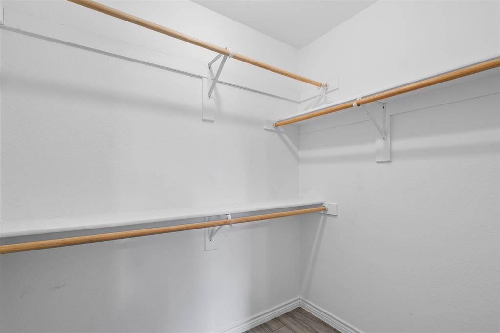 503 Caddell Street Aubrey, TX 76227 - Photo 28 of 39 a view of small space with racks on the wall