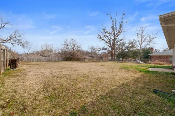a view of open space with green field