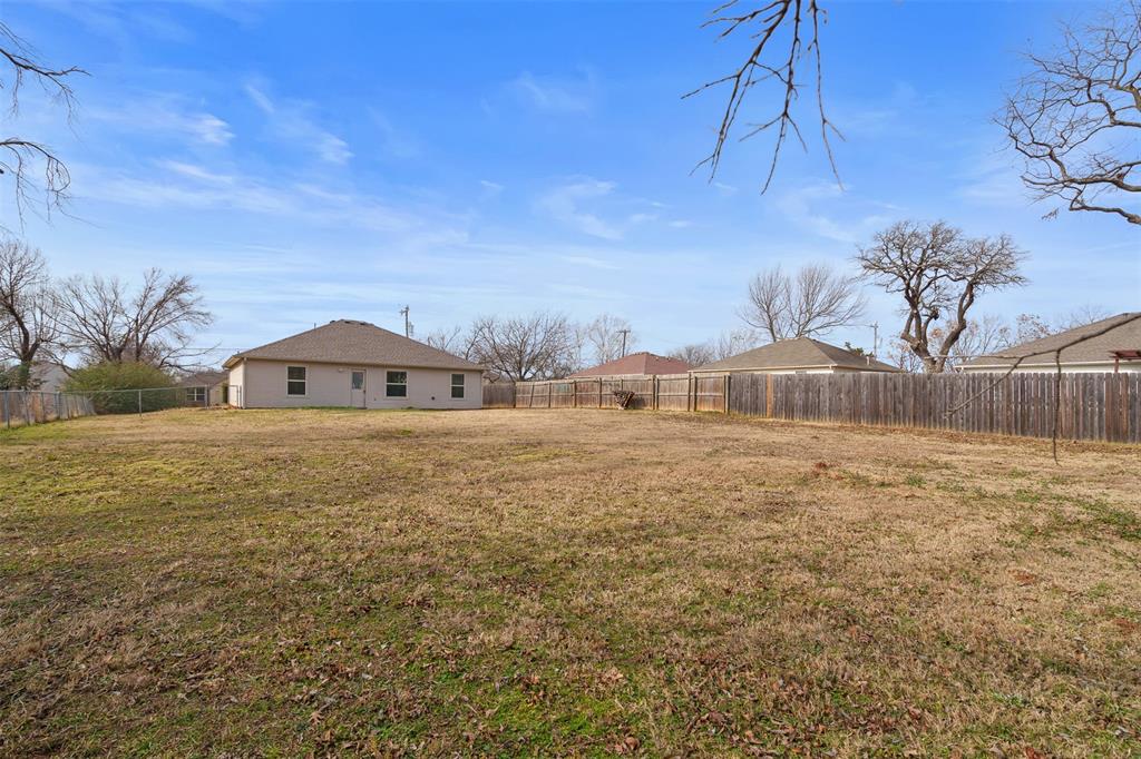 503 Caddell Street Aubrey, TX 76227 - Photo 36 of 39 a view of a house with a yard