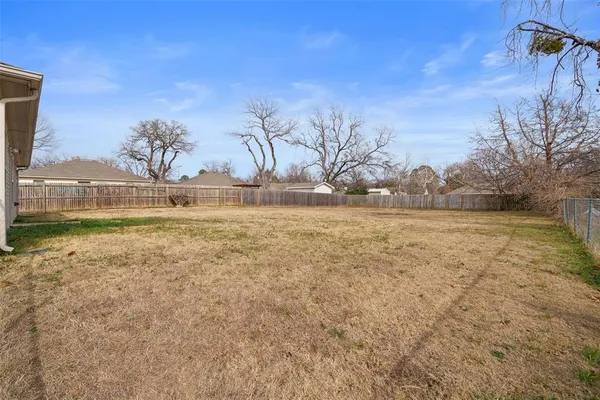 a view of a yard with an outdoor space