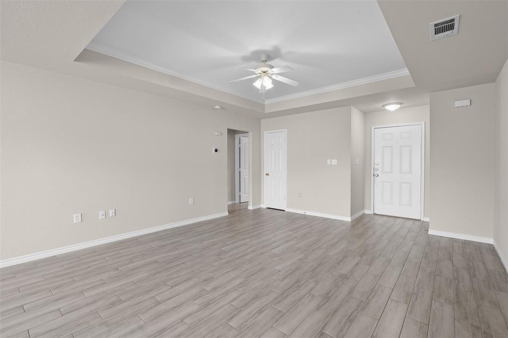 503 Caddell Street Aubrey, TX 76227 - Photo 10 of 39 a view of an empty room with wooden floor