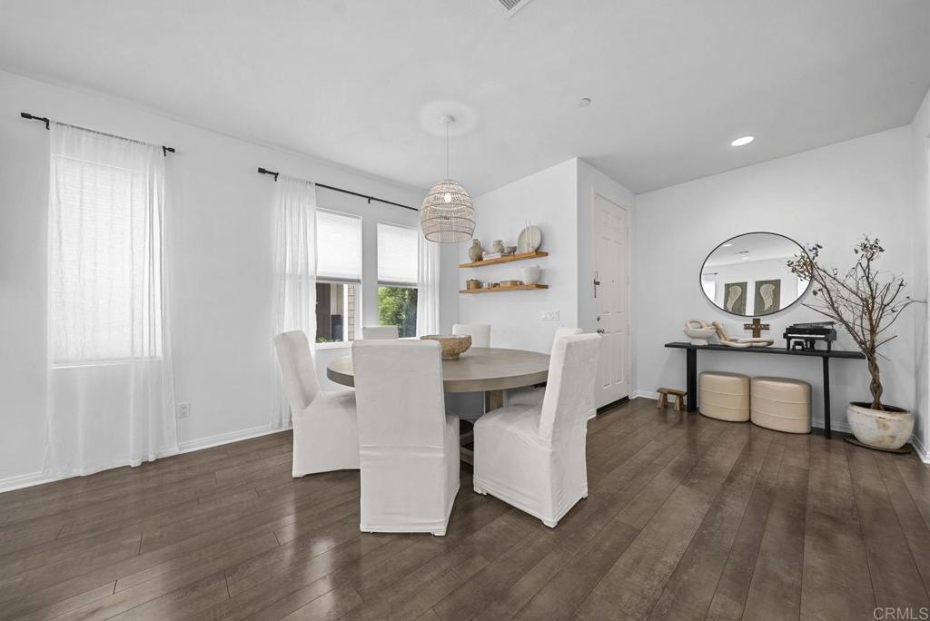 8614 Skylight Way El Cajon, CA 92021 - Photo 11 of 65 a living room with furniture a window and wooden floor