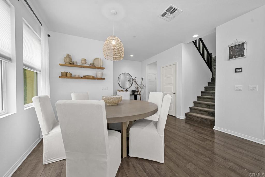 8614 Skylight Way El Cajon, CA 92021 - Photo 13 of 65 a view of a dining room with furniture and wooden floor
