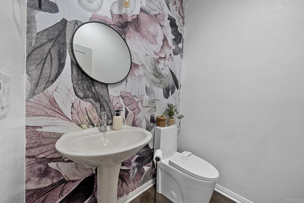 8614 Skylight Way El Cajon, CA 92021 - Photo 14 of 65 a bathroom with a toilet sink and mirror