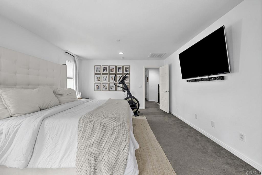8614 Skylight Way El Cajon, CA 92021 - Photo 17 of 65 a bedroom with a bed and a flat screen tv