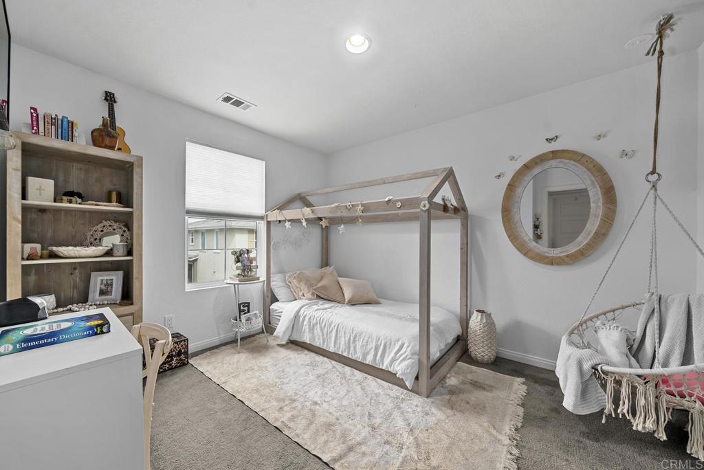 8614 Skylight Way El Cajon, CA 92021 - Photo 24 of 65 a bedroom with a bed and a window