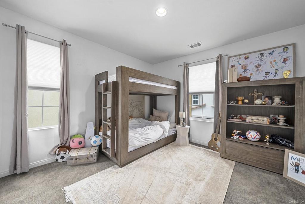 8614 Skylight Way El Cajon, CA 92021 - Photo 26 of 65 a bedroom with bed and furniture