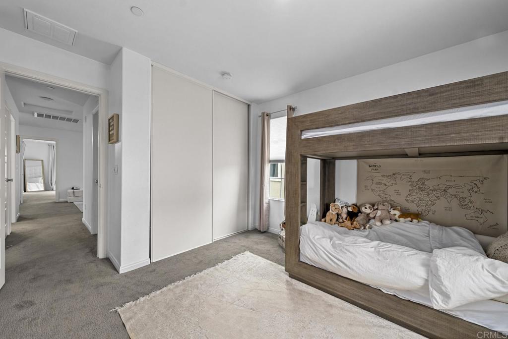 8614 Skylight Way El Cajon, CA 92021 - Photo 27 of 65 a bedroom with a bed and a couch