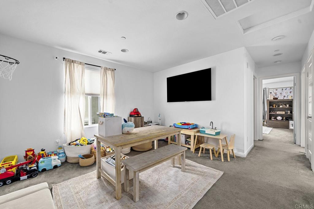 8614 Skylight Way El Cajon, CA 92021 - Photo 29 of 65 a living room with furniture and a flat screen tv