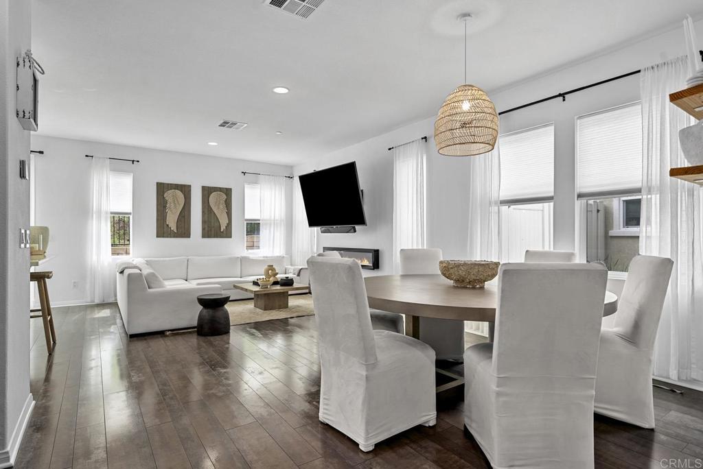 8614 Skylight Way El Cajon, CA 92021 - Photo 3 of 65 a living room with furniture flat screen tv and wooden floor