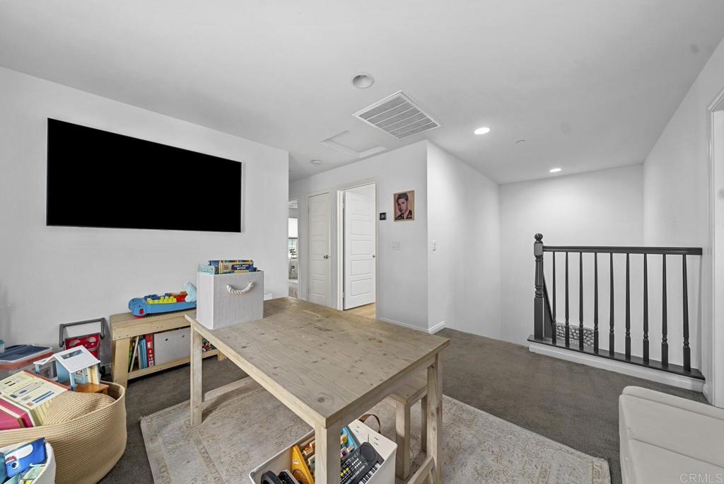 8614 Skylight Way El Cajon, CA 92021 - Photo 31 of 65 a living room with furniture and a flat screen tv