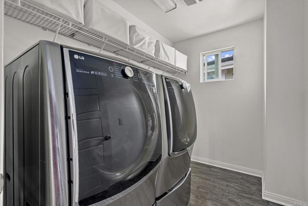 8614 Skylight Way El Cajon, CA 92021 - Photo 32 of 65 a view of a hallway with wooden floor and staircase