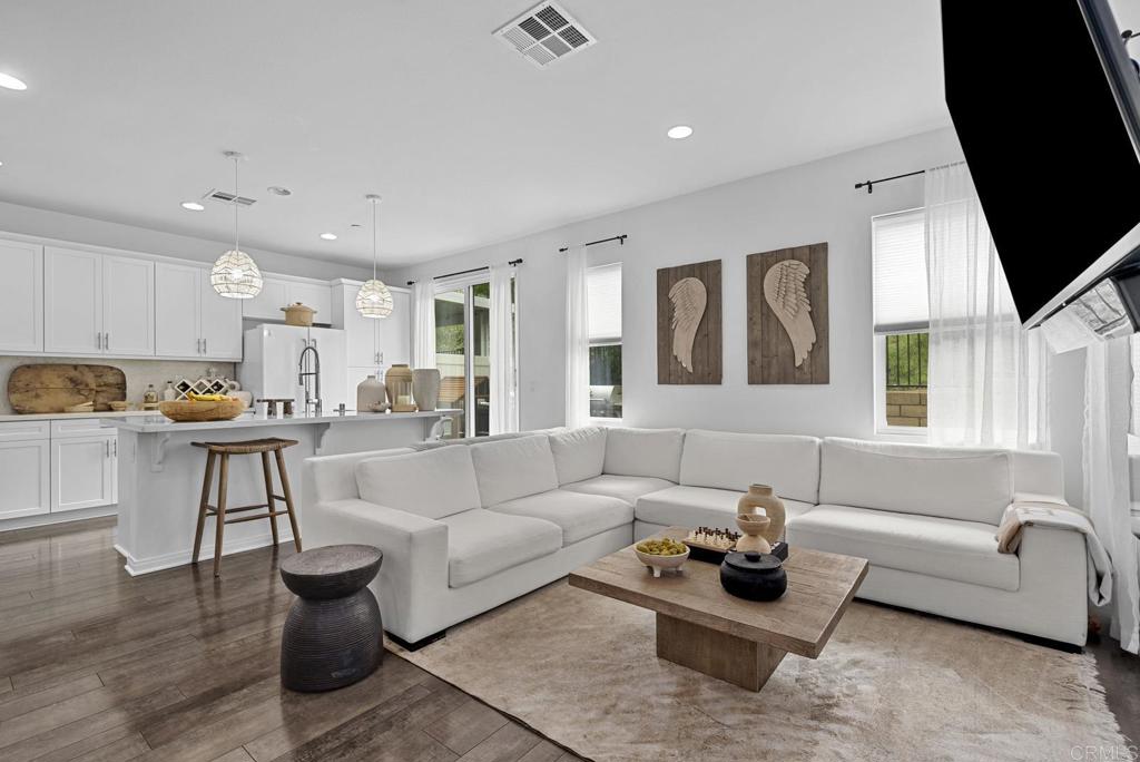 8614 Skylight Way El Cajon, CA 92021 - Photo 4 of 65 a living room with furniture and a table