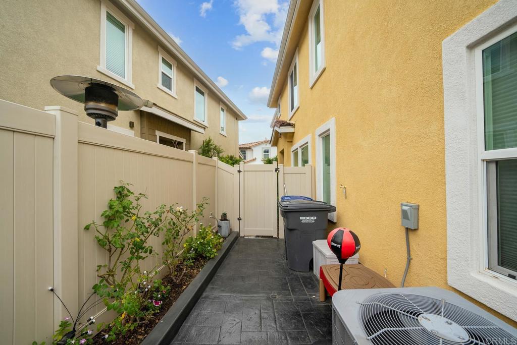 8614 Skylight Way El Cajon, CA 92021 - Photo 47 of 65 a front view of a house with outdoor seating