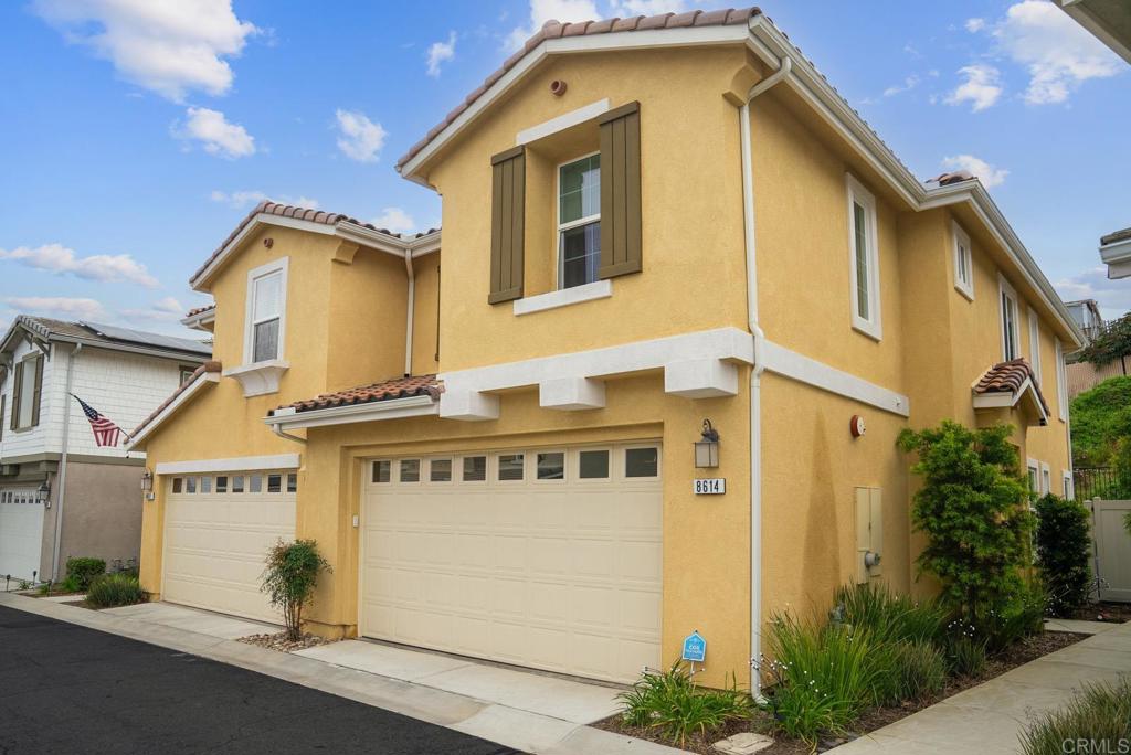 8614 Skylight Way El Cajon, CA 92021 - Photo 48 of 65 a front view of a house with a garage