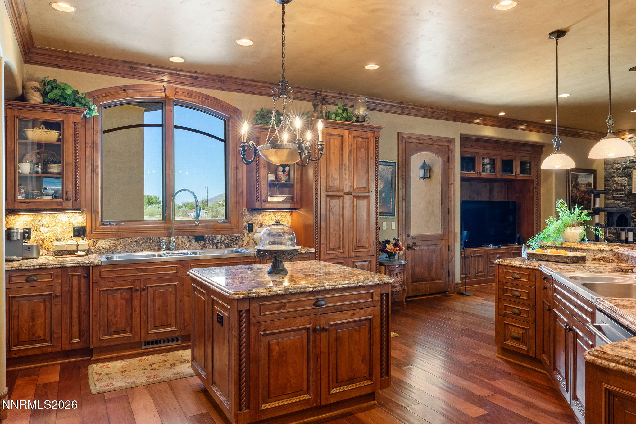 123 Andrew Lane Reno, NV 89521 - Photo 18 of 50 a kitchen with a sink stove and wooden cabinets
