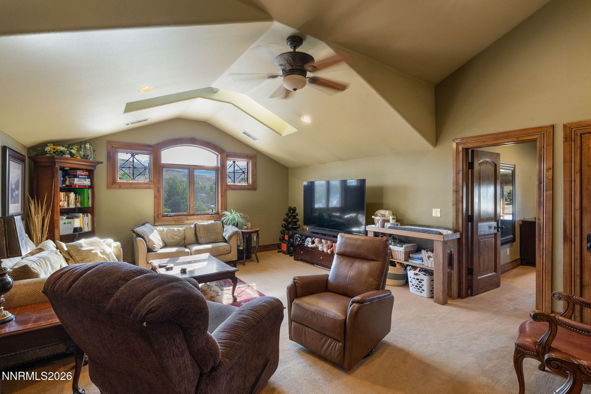 123 Andrew Lane Reno, NV 89521 - Photo 38 of 50 a living room with furniture and a flat screen tv