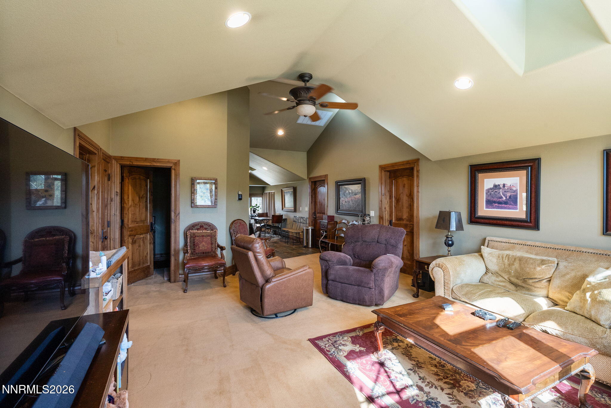 123 Andrew Lane Reno, NV 89521 - Photo 39 of 50 a living room with furniture and a flat screen tv